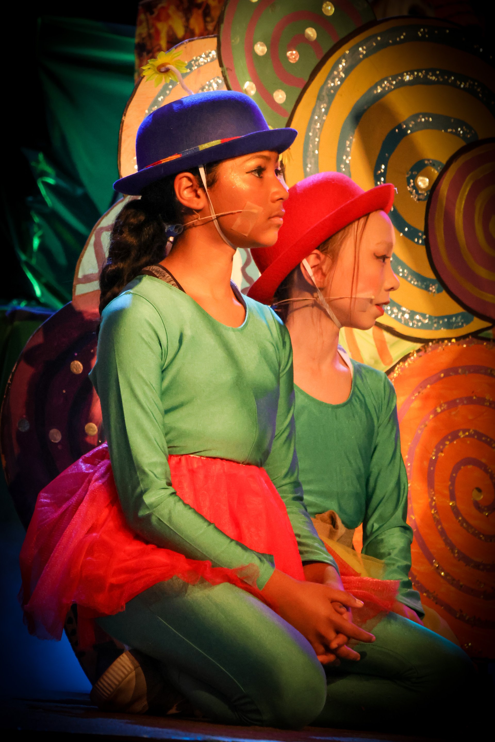 elementary students holding art projects