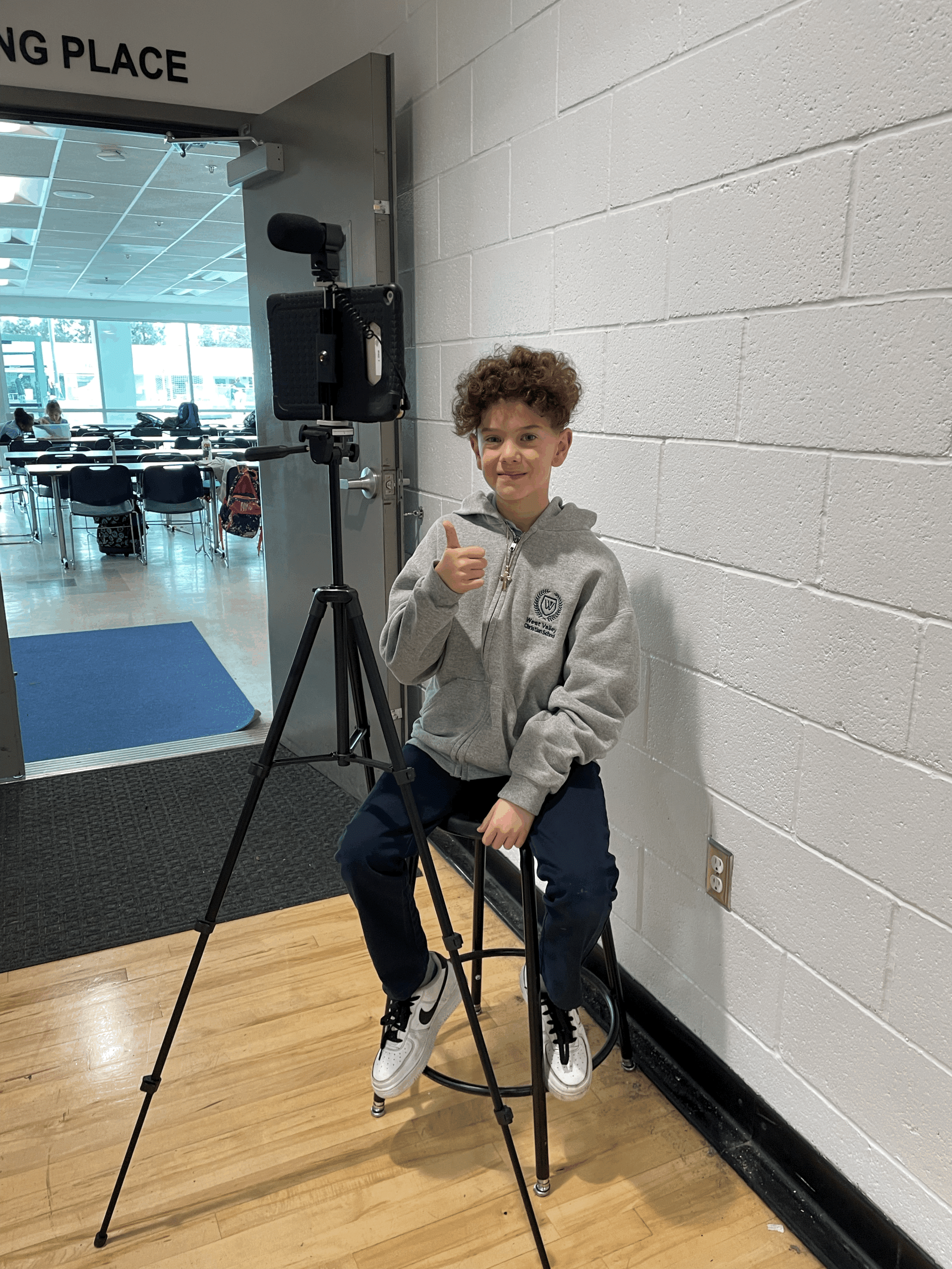 middle school students working on laptops